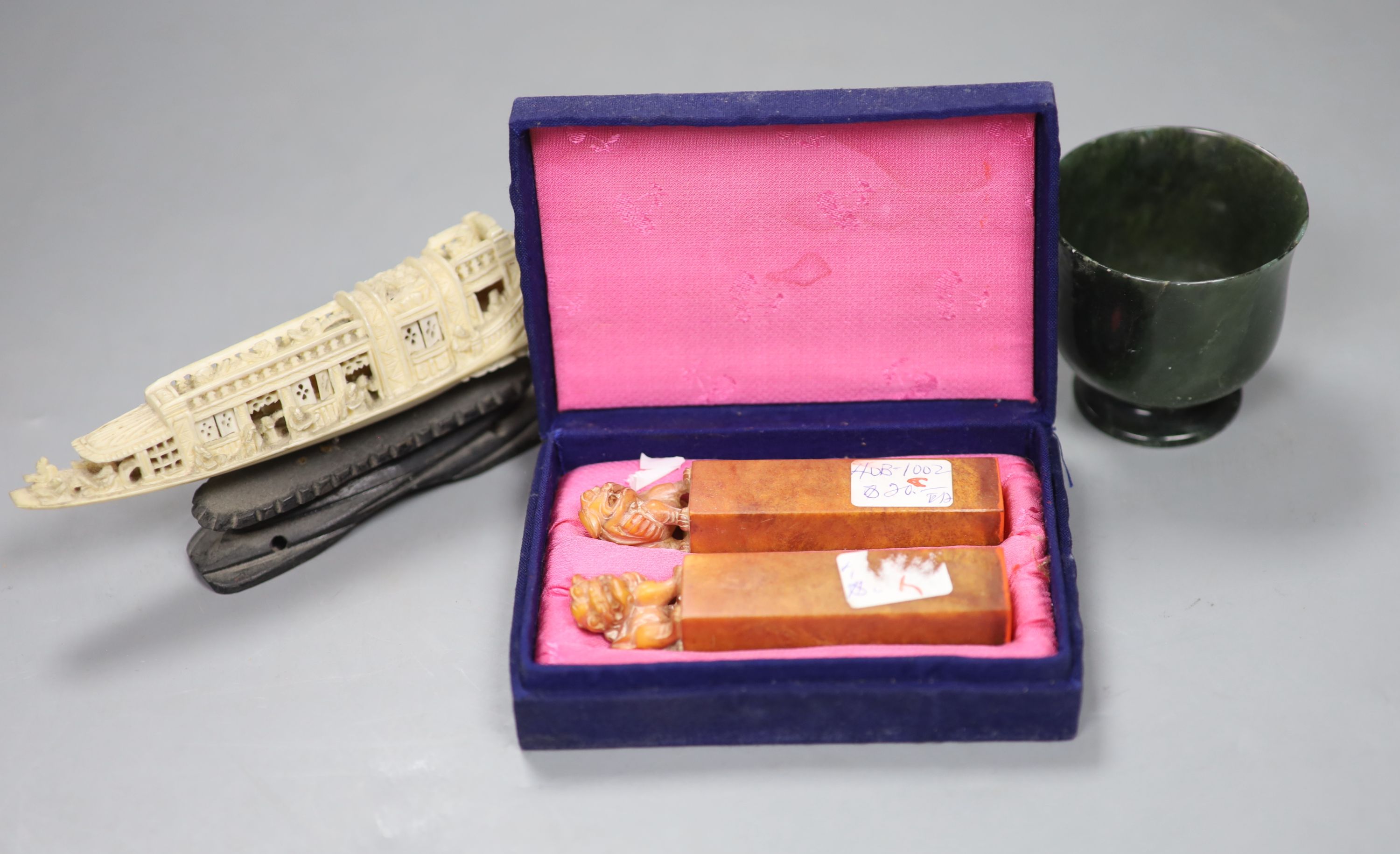 Two cased Chinese seals, a hardstone shaker and a carved ivory model of a junk on stand